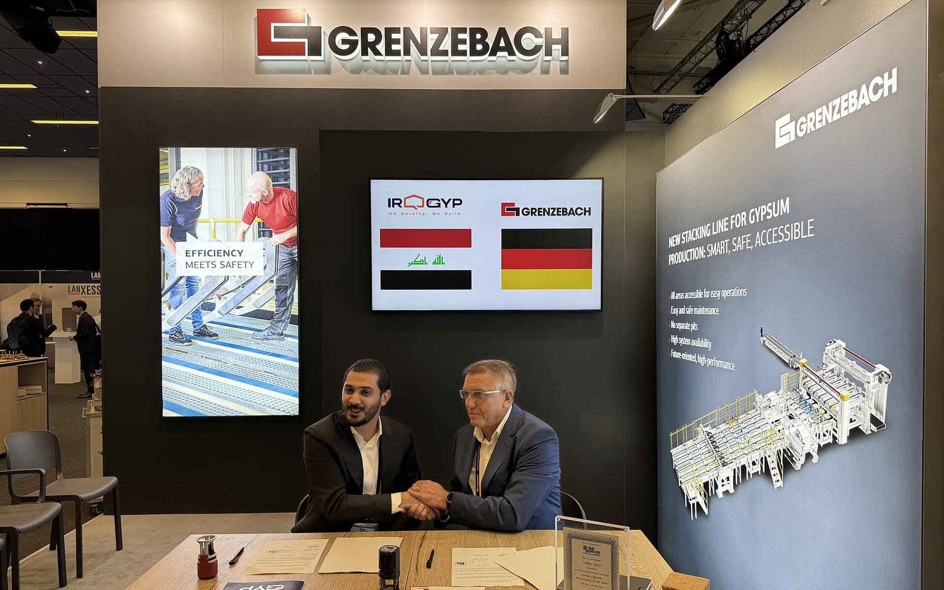Contract signing between Grenzebach and IRQGYP at Global Gypsum Conference 2025.